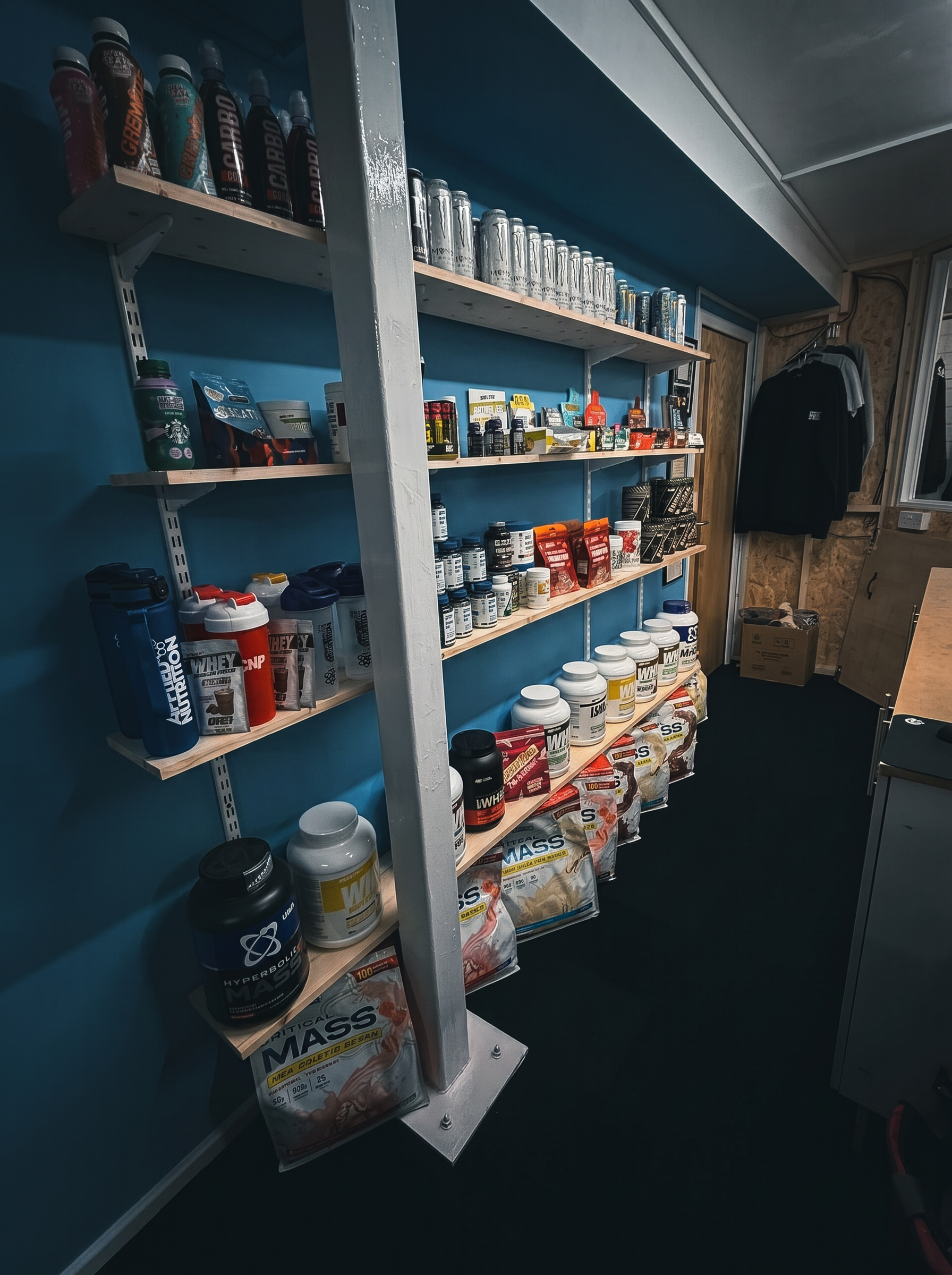 Supplement stock shelves at Midnight Gym and Fitness